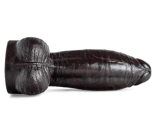 A black dildo with a smooth texture and a curved shape, lying horizontally on its side as if asleep, on a white surface.