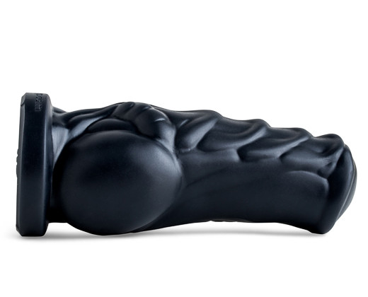 A big black rubber cock with a black head, perfect for those who like it bold and daring.