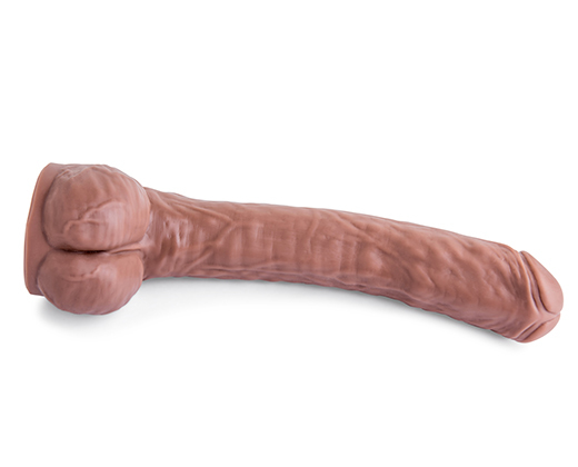 A long rubber dildo on a white background.