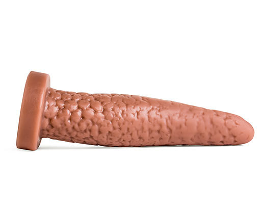 A large, brown rubber and textured dildo on a white background.