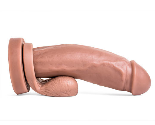 A large rubber cock with a large hole, perfect for a fun and playful bath time accessory.