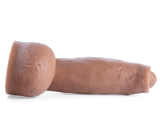 White background with a big brown rubber dildo.