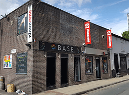 Brick building featuring Base sign